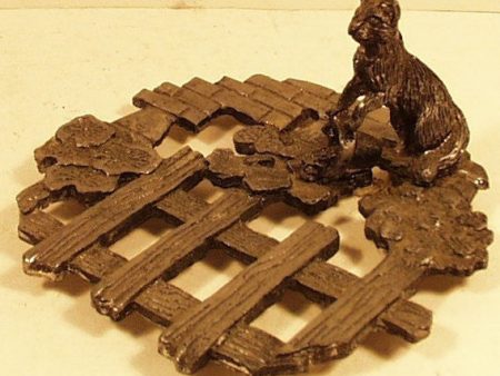 Metal trivet w  cat spilling bucket dated 1986 Etzke Sale